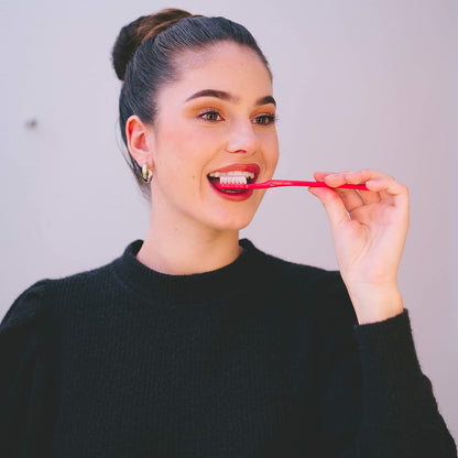 woman using Collis-Curve toothbrush